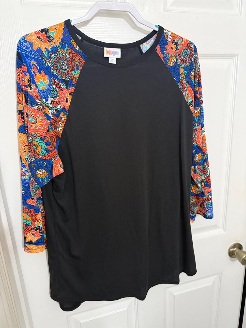 LuLaRoe Black Tunic with Bright Multicolor Paisley Raglan Sleeves
